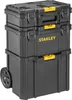 A stack of three black Stanley toolboxes, with yellow accents, on a white background. The bottom toolbox has wheels. Voir les images du produit