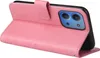 A pink flip phone case with floral and butterfly embossed details, showing the back of a phone with a camera module. Produktbild-Vorschau