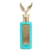 A perfume bottle with a gold eagle topper. Podgląd zdjęcia produktu