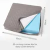 A gray orthopedic seat cushion with a portion of the cover pulled back to reveal the blue foam interior. Measurement indicators and text are present. Náhled obrázku produktu