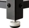 Close-up of the bottom of a black metal furniture leg with an adjustable foot. Produktbild-Vorschau