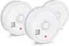 Three white smoke detectors are arranged diagonally on a white surface. Voir les images du produit