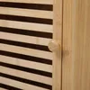 Close-up of a wooden cabinet door with a round knob. Voir les images du produit