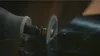 A close-up shot of a rotary tool cutting into a dark, reflective surface. Anteprima dell’immagine prodotto