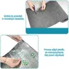 The image shows two separate instructional panels. The top panel demonstrates cutting a gray felt-like material with scissors. The bottom panel shows a hand peeling a protective plastic layer from a silver, reflective material with grid markings. Produktbild-Vorschau