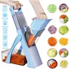 A person is using a blue vegetable slicer to cut a carrot, with various sliced vegetables displayed around the product. Voir les images du produit