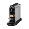 A silver and black Nespresso coffee machine with a cup of espresso. Podgląd zdjęcia produktu