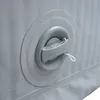 A close-up view of an inflatable valve on a gray and white surface. Podgląd zdjęcia produktu