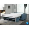 A sofa bed is shown in a living room setting with a fireplace and a window in the background. Anteprima dell’immagine prodotto