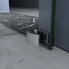 Close-up of a shower door bottom track and roller mechanism. Produktbild-Vorschau