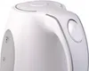Close-up of the top and side of a white electric kettle. Voir les images du produit