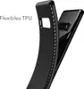 A black phone case with a carbon fiber texture is shown partially covering a black smartphone. Produktbild-Vorschau