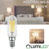 A bedroom scene with lamps and a bed, featuring a close-up of an LED light bulb. Produktbild-Vorschau