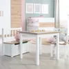 A child's play area with a table, chairs, and a crib. Produktbild-Vorschau