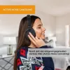 A woman wearing headphones in a room. Anteprima dell’immagine prodotto