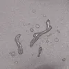 Water droplets on a textured gray surface. Produktbild-Vorschau