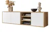 A wall-mounted TV cabinet with white doors and open shelves, decorated with a vase of dried flowers and a bust sculpture. Produktbild-Vorschau