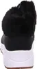 The back view of a black and white sneaker with a black fur trim. Voir les images du produit