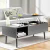 A modern living room scene featuring a gray lift-top coffee table with storage. Voir les images du produit