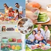 Collage of images showing a family at the beach, food being covered, food in a refrigerator, and a family having a picnic. Produktbild-Vorschau