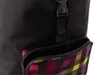 A close-up view of a black shopping trolley with a colorful plaid zippered pocket. Produktbild-Vorschau