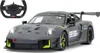 A remote-controlled Porsche 911 GT2 RS Clubsport 25 toy car and its steering wheel controller are shown against a white background. Podgląd zdjęcia produktu