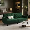 A living room scene with a green sofa bed, a bed, a lamp, and a plant. Produktbild-Vorschau