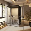 A modern home office setup featuring a glass-enclosed work pod with a standing desk and chair. Produktbild-Vorschau