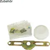 A collection of refrigerator spare parts, including a thermostat knob, mounting hardware, and a metal bracket, displayed on a white background. Produktbild-Vorschau