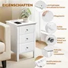A white bedside table with three drawers, shown next to a sofa. The image includes callouts highlighting product features. Podgląd zdjęcia produktu