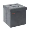 A gray velvet storage ottoman is shown against a white background. Náhled obrázku produktu