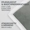 A close-up of a blanket showing its texture and edge trim, with text describing its features. Produktbild-Vorschau