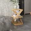 A wooden accent table with plants and books. Produktbild-Vorschau