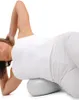 A woman is lying on her side with a pilates ball under her back. Produktbild-Vorschau