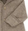 A close-up view of a baby overall made of grey wool, showing the buttons and sleeve. Produktbild-Vorschau