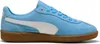 A side view of a blue Puma sneaker with a white stripe and a brown sole. Produktbild-Vorschau