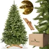A Christmas tree with its stand and packaging. Voir les images du produit