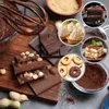 A collage of various chocolate desserts and ingredients, including chocolate bars, tarts, cake, tiramisu, cookies, and cocoa powder. Produktbild-Vorschau