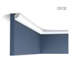 A corner of a room showing crown molding installed at the junction of a wall and ceiling. Produktbild-Vorschau