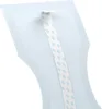 A close-up view of a light blue product with a white strip of tape attached to it. The tape has a repeating pattern of light blue text. Podgląd zdjęcia produktu
