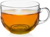 A clear glass mug filled with amber-colored liquid, likely tea or coffee, against a white background. Voir les images du produit