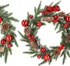 Two Christmas wreaths decorated with pinecones, red berries, and red ornaments. Náhled obrázku produktu