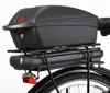 A close-up view of the rear of a bicycle, showing a black cargo box mounted on a rack above a battery pack and a red taillight. Náhľad obrázku produktu