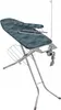 A folding ironing board with a green and blue patterned cover and a wire rack underneath. Produktbild-Vorschau