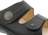 A close-up view of a black leather sandal. Produktbild-Vorschau