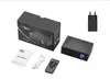 A product shot of a mini projector and its accessories, including the box, user manual, remote control, charging cable, and power adapter, arranged on a white background. Náhľad obrázku produktu