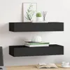 Two black floating shelves mounted on a white wall, with decorative items on them. Produktbild-Vorschau