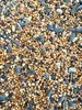 A close-up, overhead view of a pile of birdseed. Anteprima dell’immagine prodotto