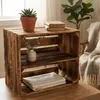 A wooden crate with shelves, decorated with a plant and books, placed on a wooden table. Náhled obrázku produktu