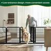An older man is opening a gate in a dog playpen for two golden retrievers to pass through in a living room. Podgląd zdjęcia produktu